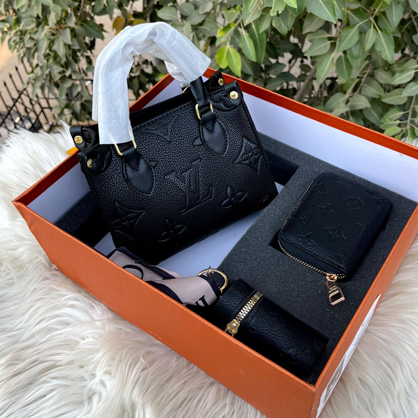 Louis Vuitton OnTheGo tote bag, with a matching wallet and other accessories