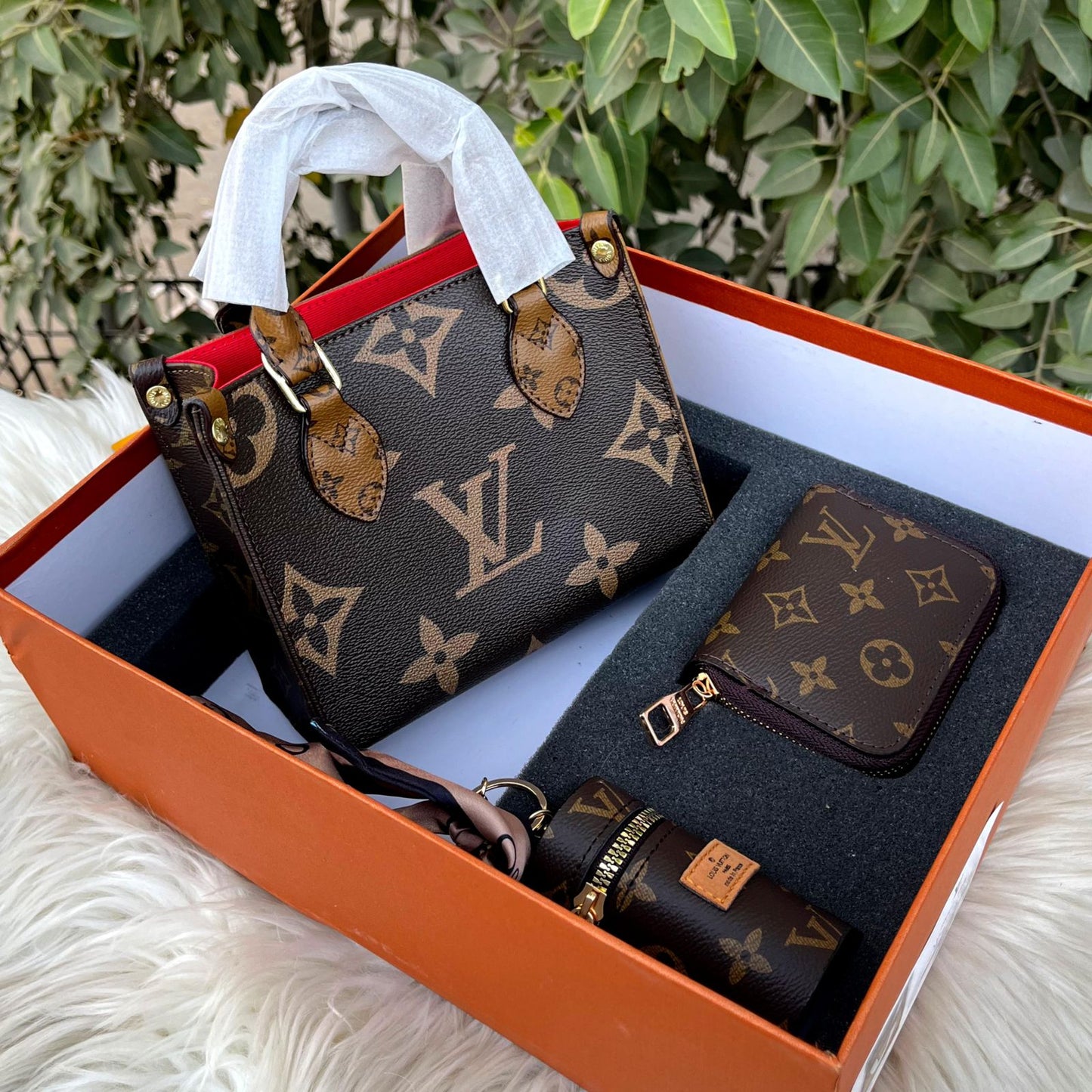 Louis Vuitton OnTheGo tote bag, with a matching wallet and other accessories